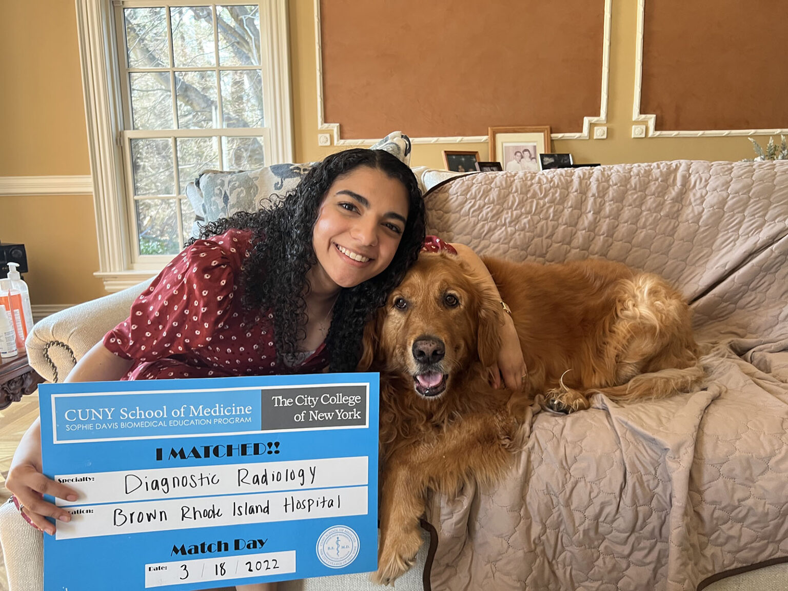 person posing with a dog