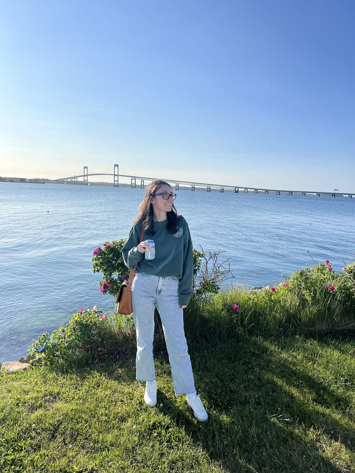 person posing in front of the water