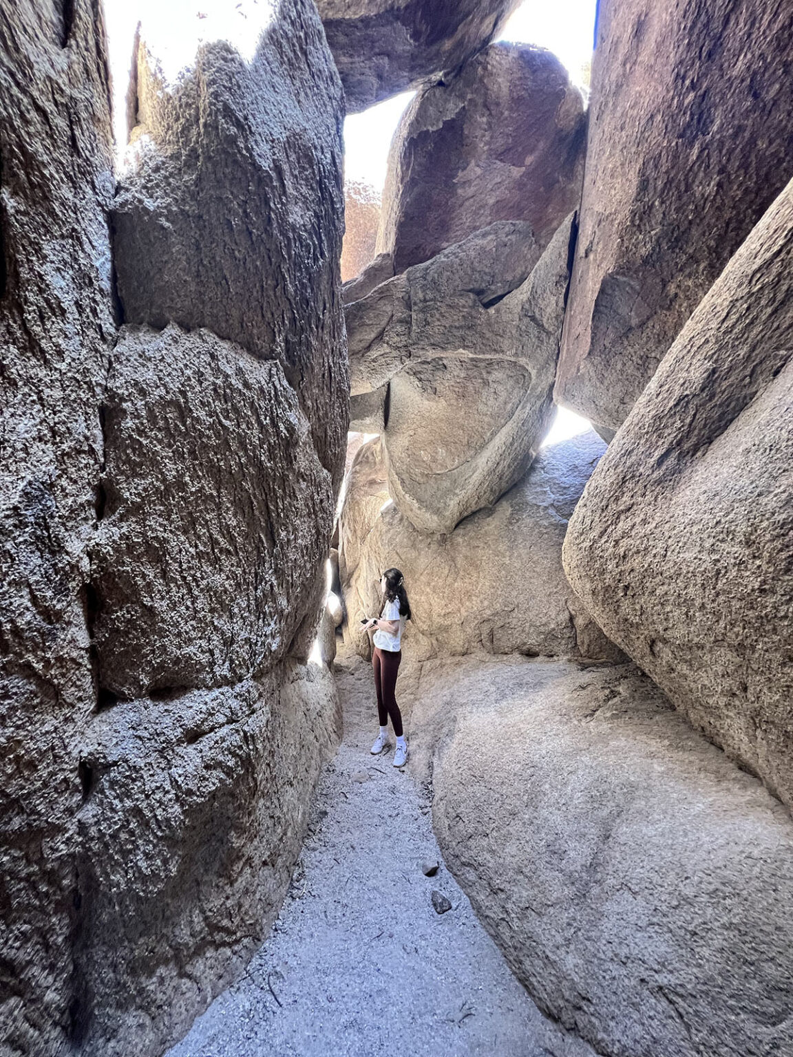 person exploring rock formation