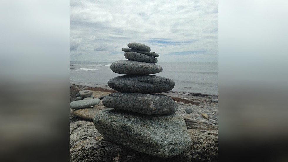 stacked stones near the ocean